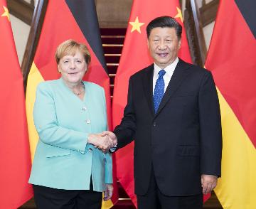 Xi meets German Chancellor Angela Merkel